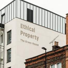 Front of The Green House, photo taken at an angle to show sigange reading: Ethical Property The Green House in silver letters